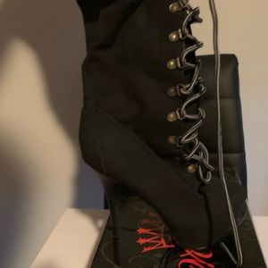 Brand new, over the knee lace up boot.